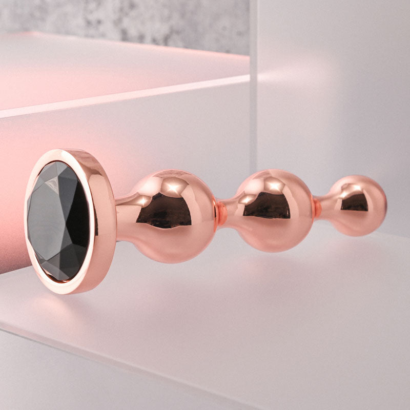 Gender X Gold Digger Large Rose Gold Large Butt Plug With Black Gem Base