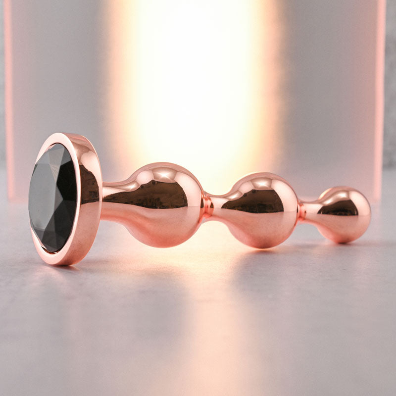 Gender X Gold Digger Large Rose Gold Large Butt Plug With Black Gem Base